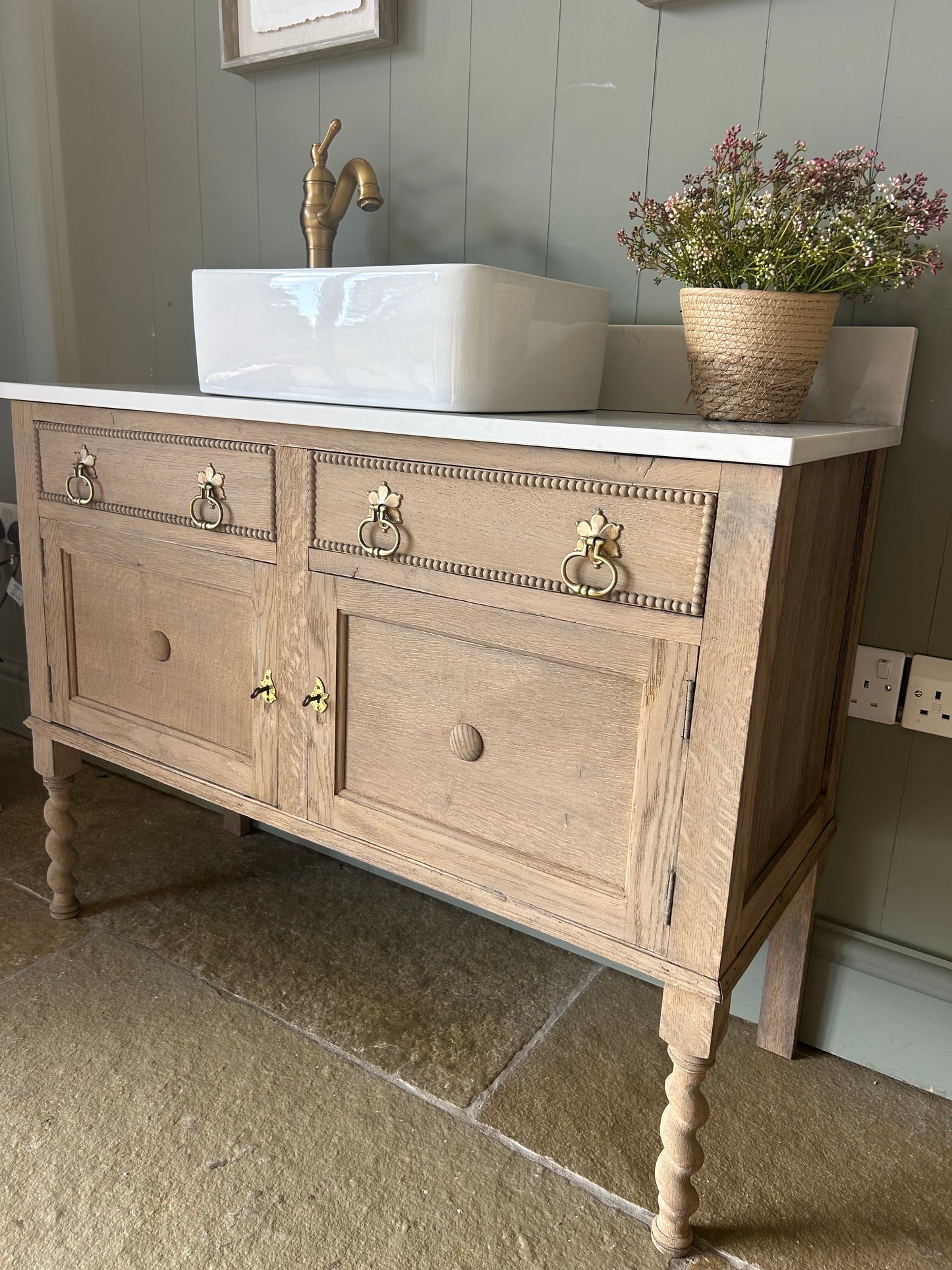 Rustic light Oak Vanity sink with quartz top, basin and Upstand.