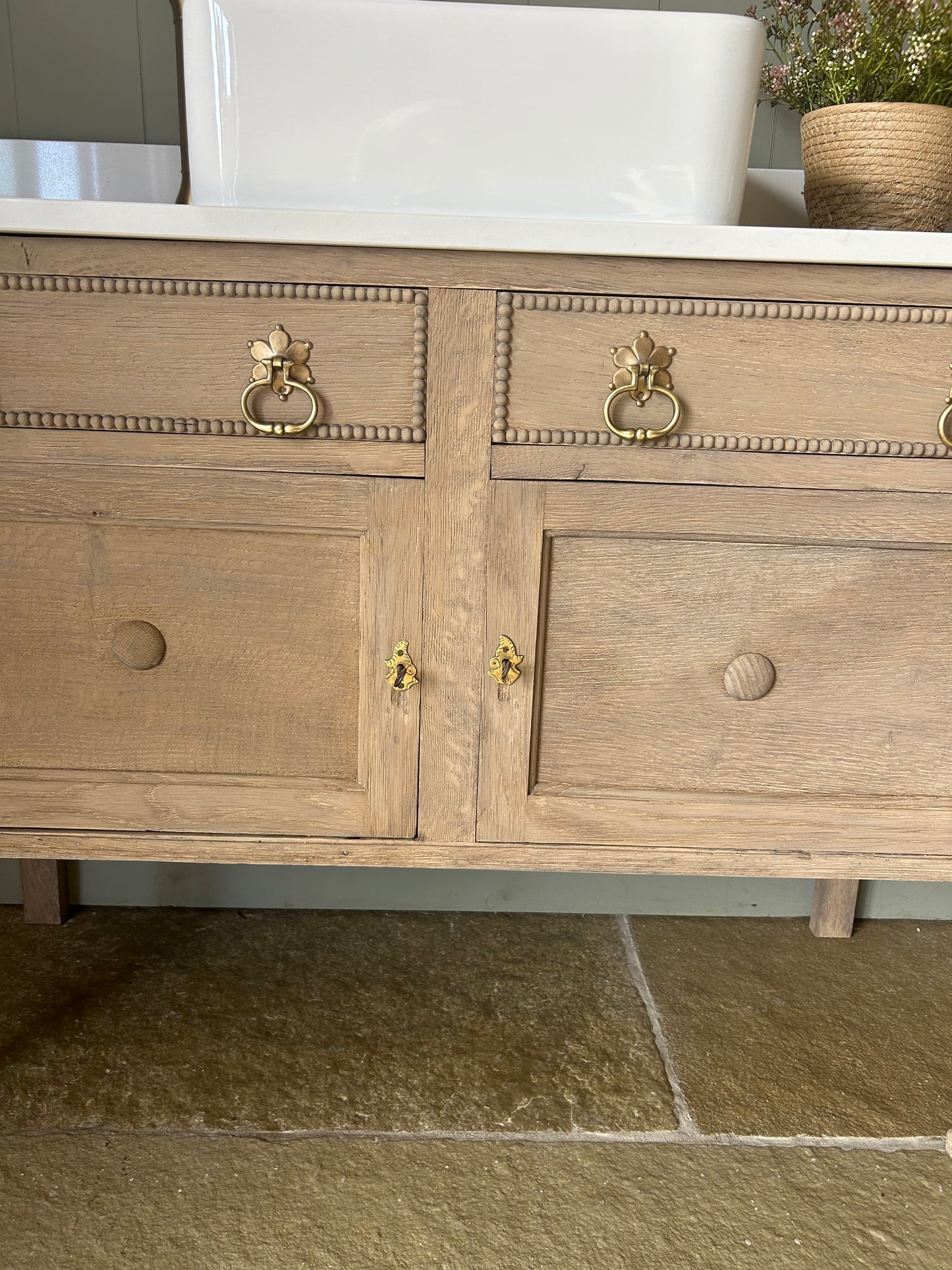 Rustic light Oak Vanity sink with quartz top, basin and Upstand.