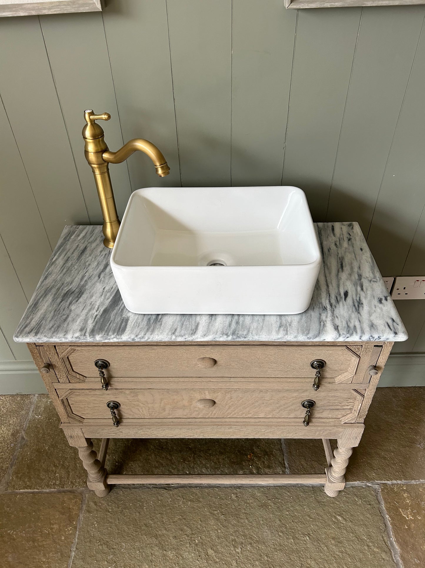 Vintage Marble Top Vanity Sink finished in a weathered oak style.