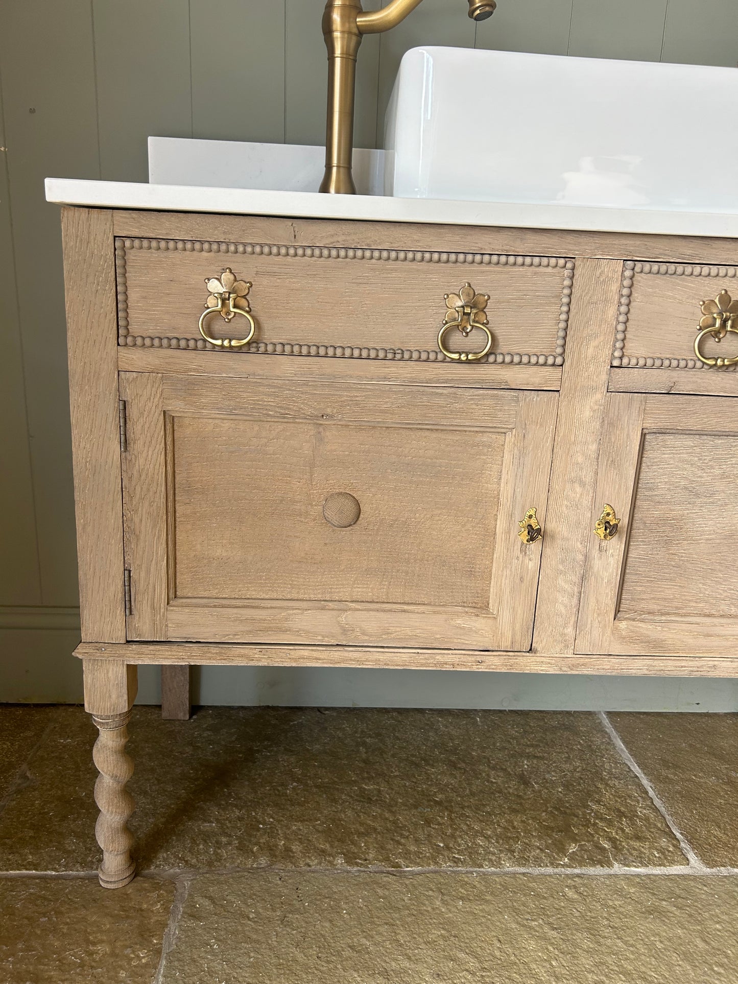 Rustic light Oak Vanity sink with quartz top, basin and Upstand.
