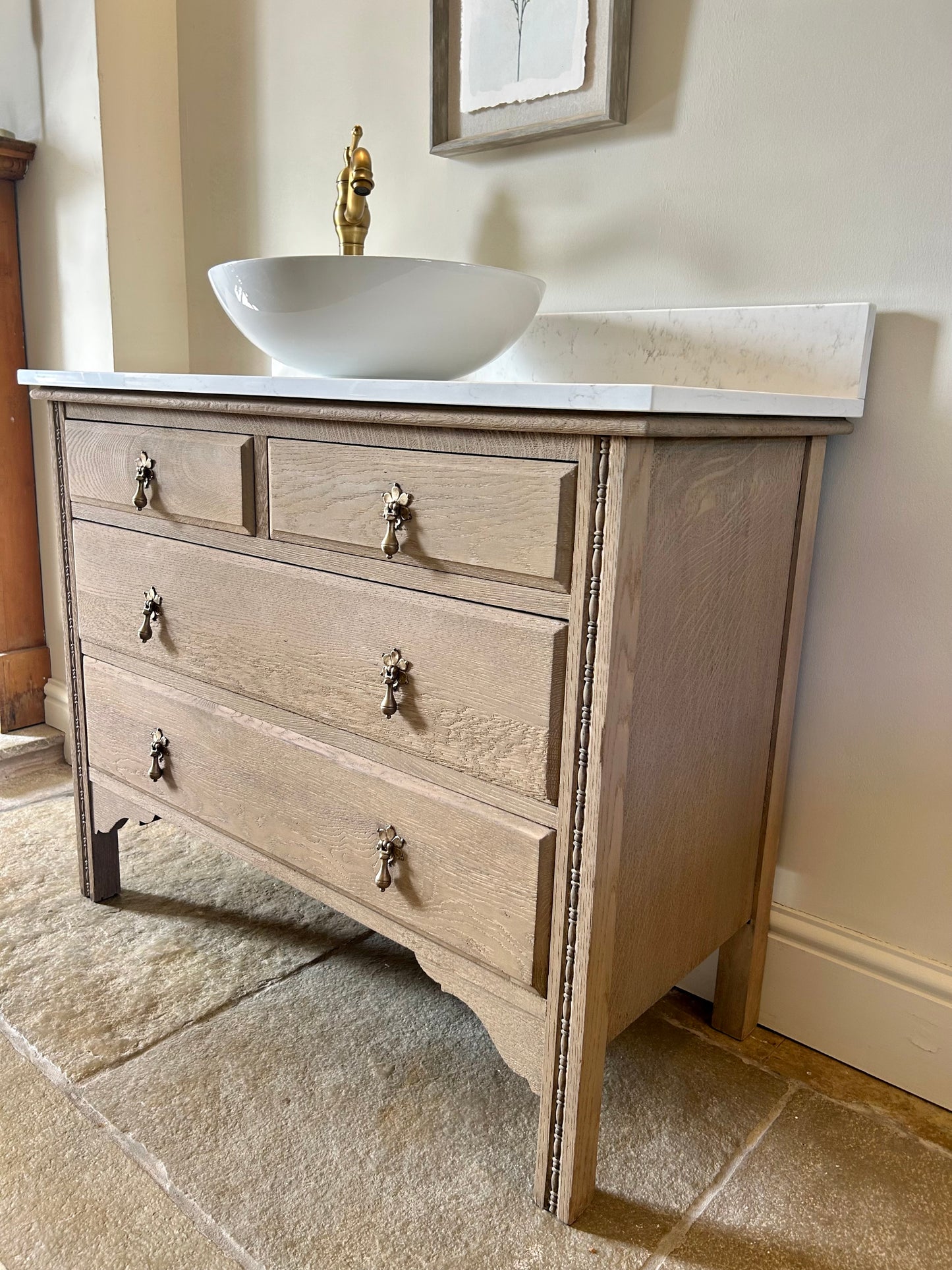 Large Single Vanity Sink finished in a light weathered oak style. Marble/quartz top and Upstand. 100.5 cm wide