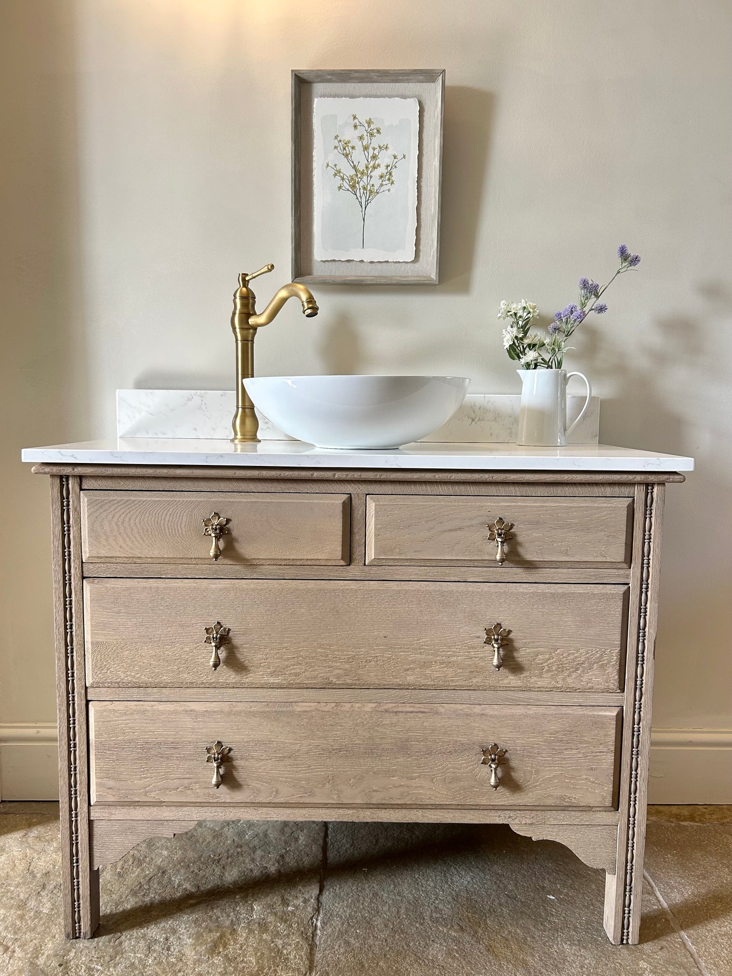 Large Single Vanity Sink finished in a light weathered oak style. Marble/quartz top and Upstand. 100.5 cm wide