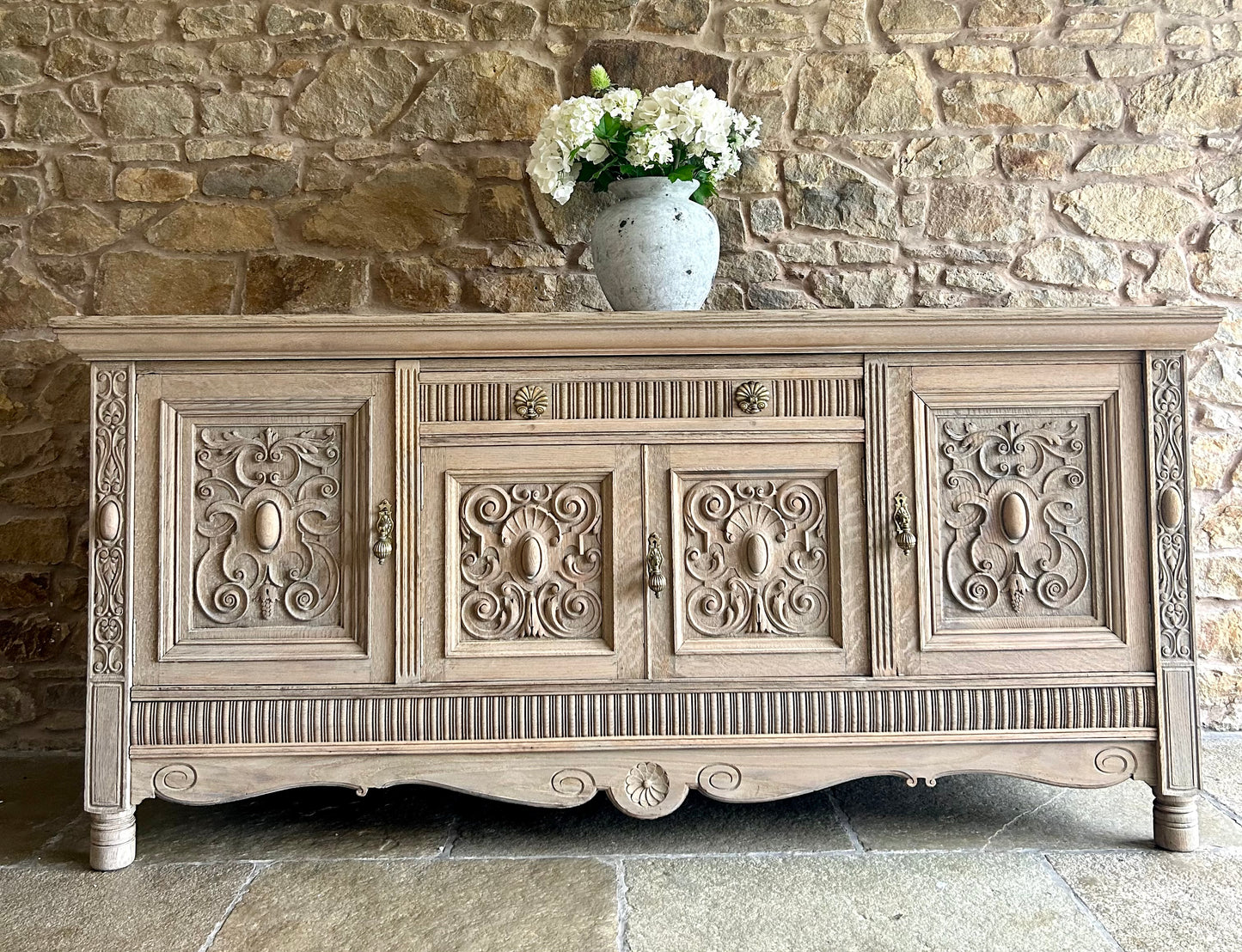 Extra Large Ornate Solid Oak Sideboard finished in a light weathered oak finish.