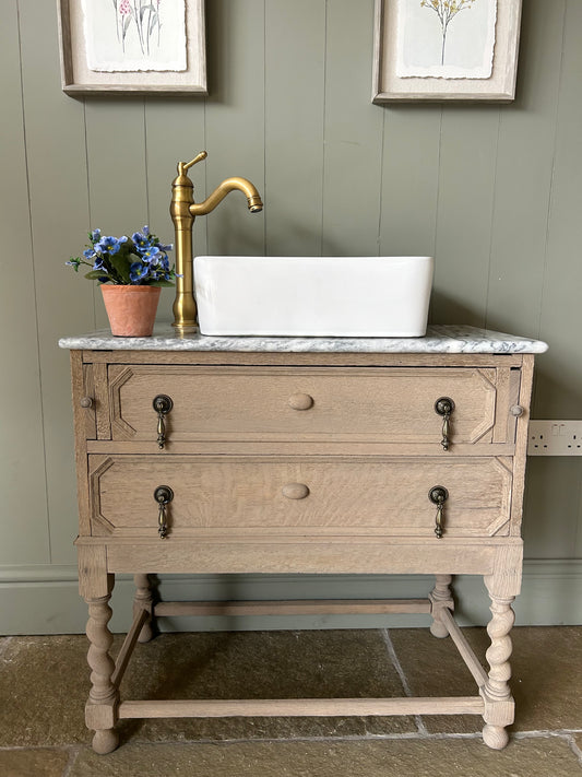Vintage Marble Top Vanity Sink finished in a weathered oak style.