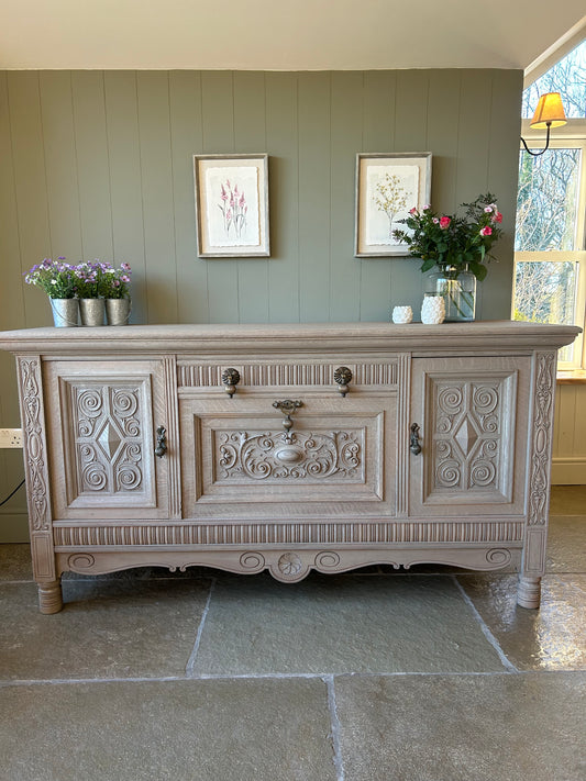 Large Vintage Weathered Oak Sideboard with Swirl Carvings and Brass Handles. Maple and Co.