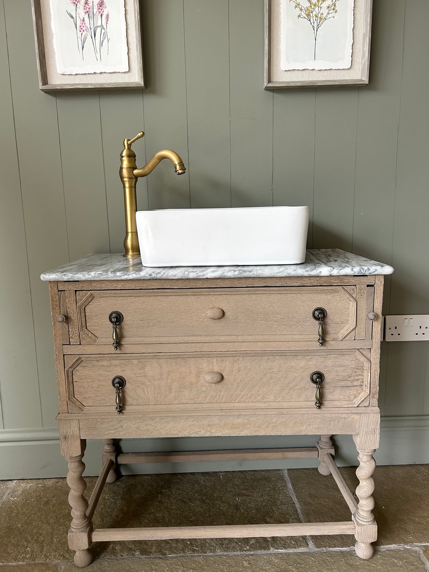 Vintage Marble Top Vanity Sink finished in a weathered oak style.