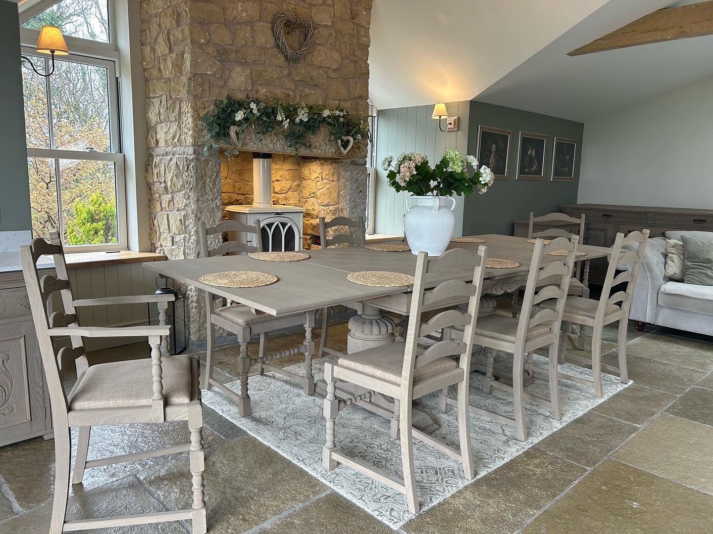 Extra Large Extending 280cm Solid Oak Dining Table with 8 chairs Set finished in a Weathered Oak style.