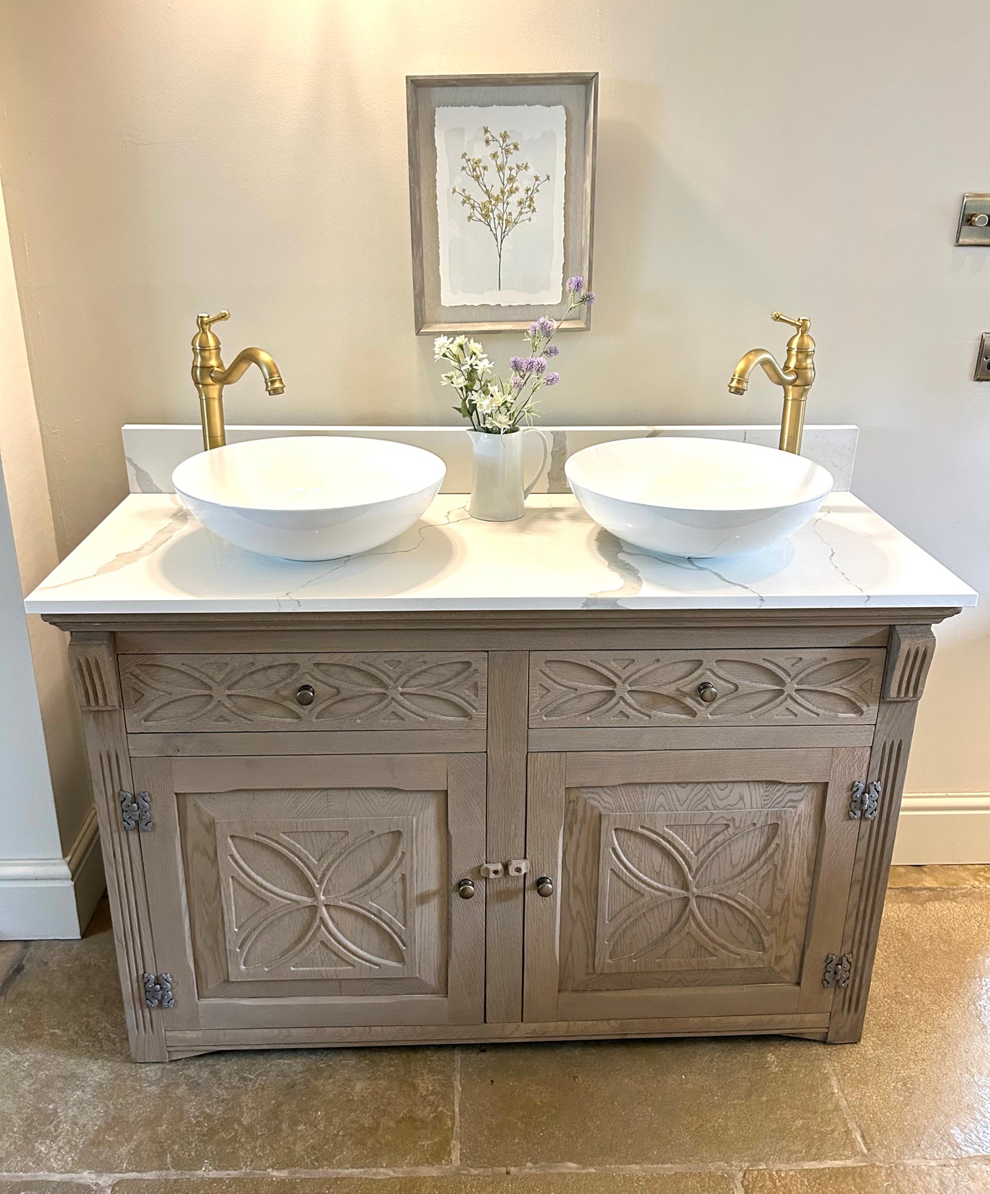 Double Vanity Sink Finished in a Weathered Weathered oak with marble / quartz top.