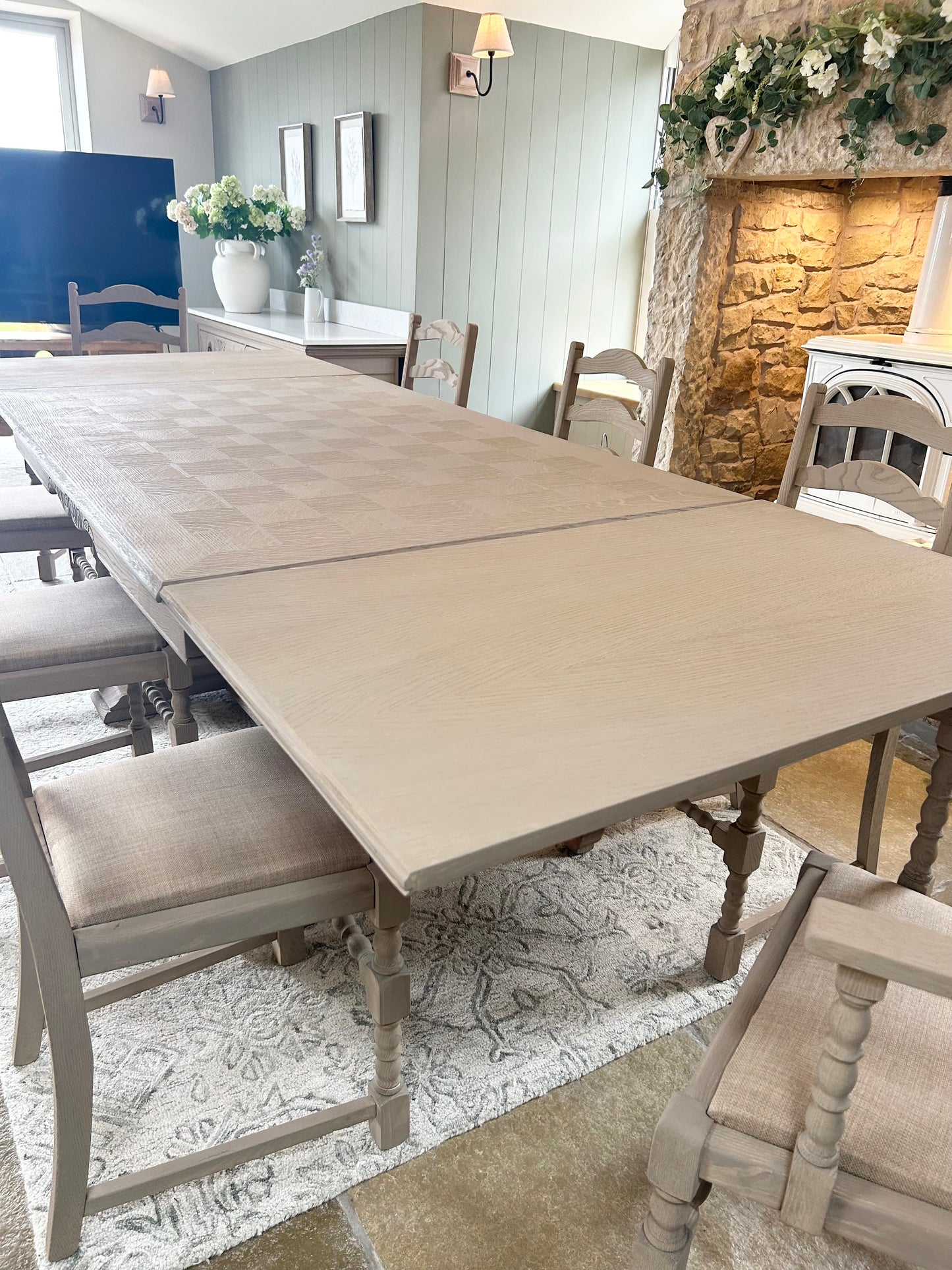 Extra Large Extending 280cm Solid Oak Dining Table with 8 chairs Set finished in a Weathered Oak style.