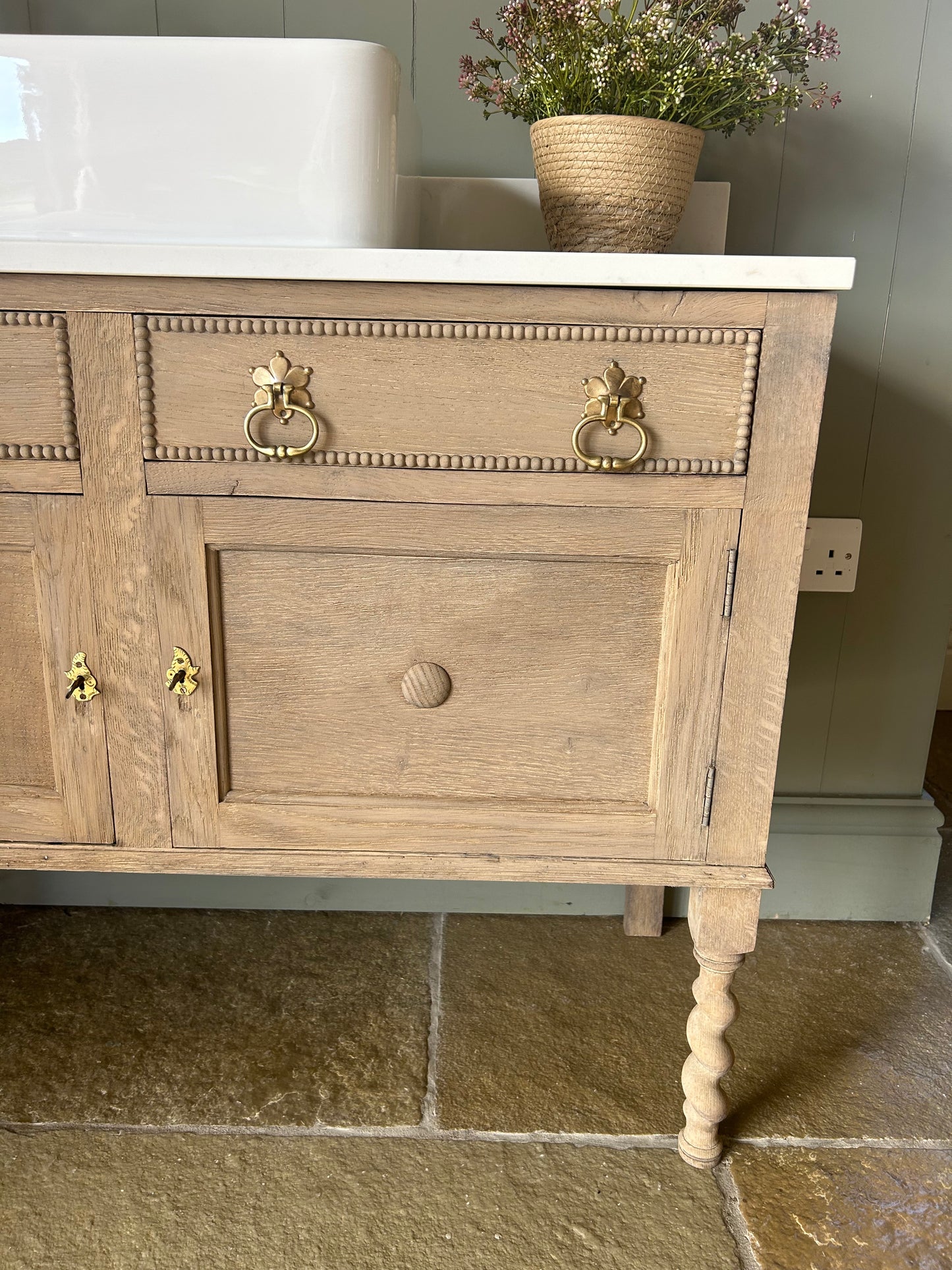 Rustic light Oak Vanity sink with quartz top, basin and Upstand.