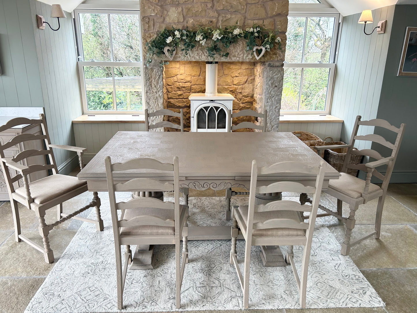 Extra Large Extending 280cm Solid Oak Dining Table with 8 chairs Set finished in a Weathered Oak style.