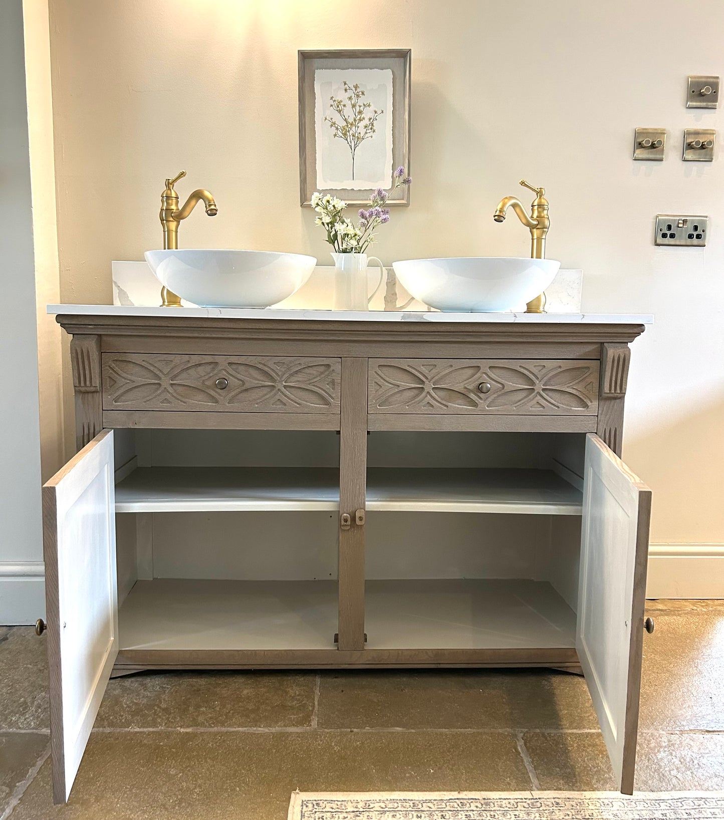 Double Vanity Sink Finished in a Weathered Weathered oak with marble / quartz top.