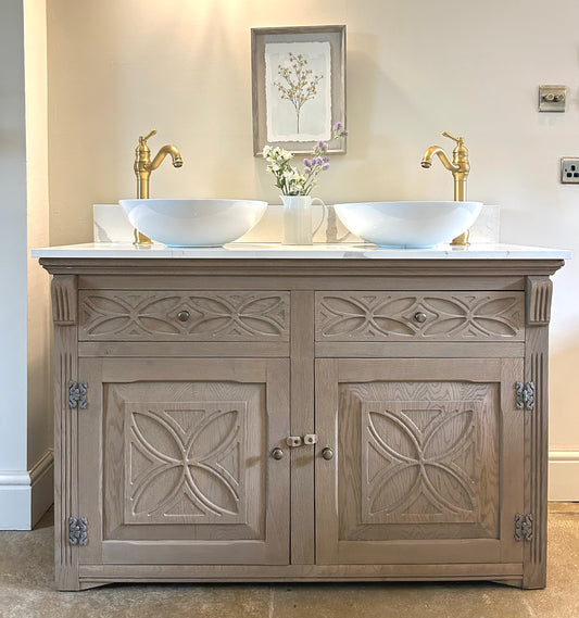 Double Vanity Sink Finished in a Weathered Weathered oak with marble / quartz top.